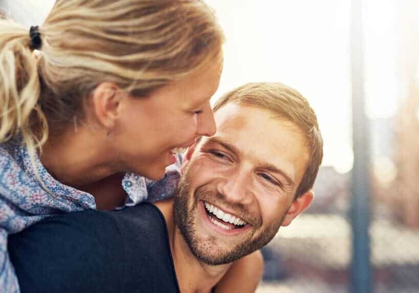 happy couple smiling together after wellness care visit to Active Edge