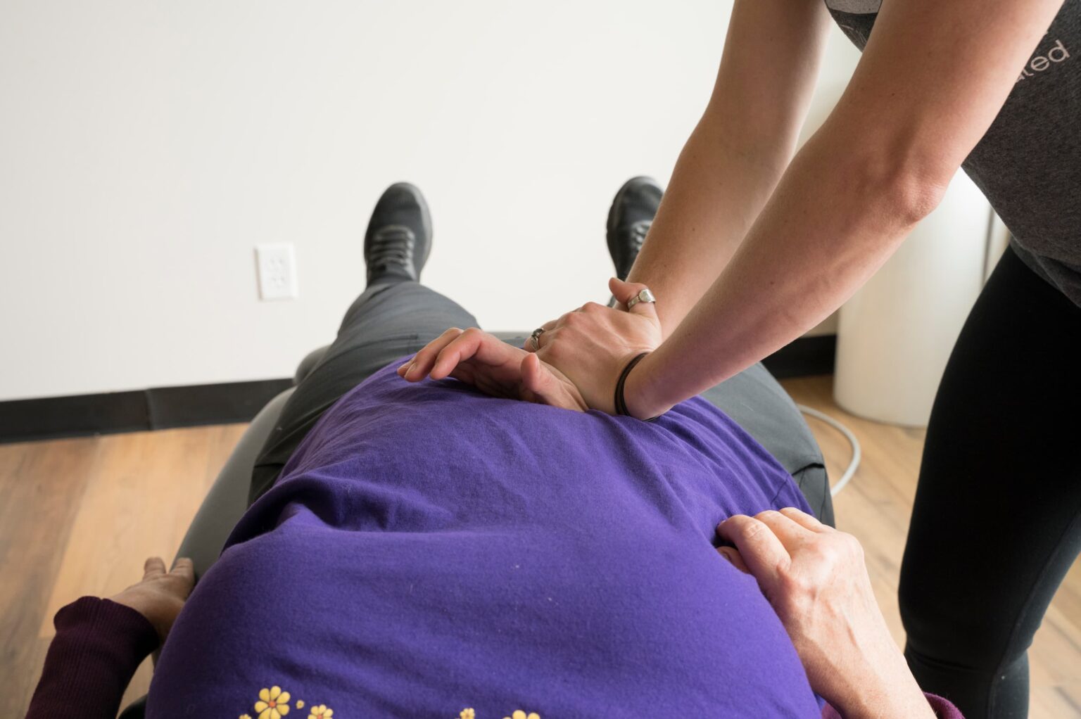 a female patient receiving chiropractic care from Active Edge Chiropractor