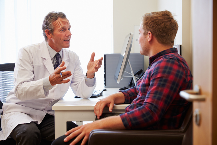 A doctor in Active Edge explaining functional medicine to a patient in Columbus Ohio